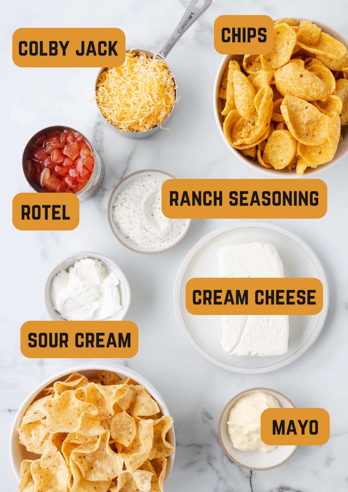 ingredients needed to make boat dip in bowls with text overlays reading: colby jack, chips, rotel, ranch seasoning, sour cream, cream cheese, mayo"