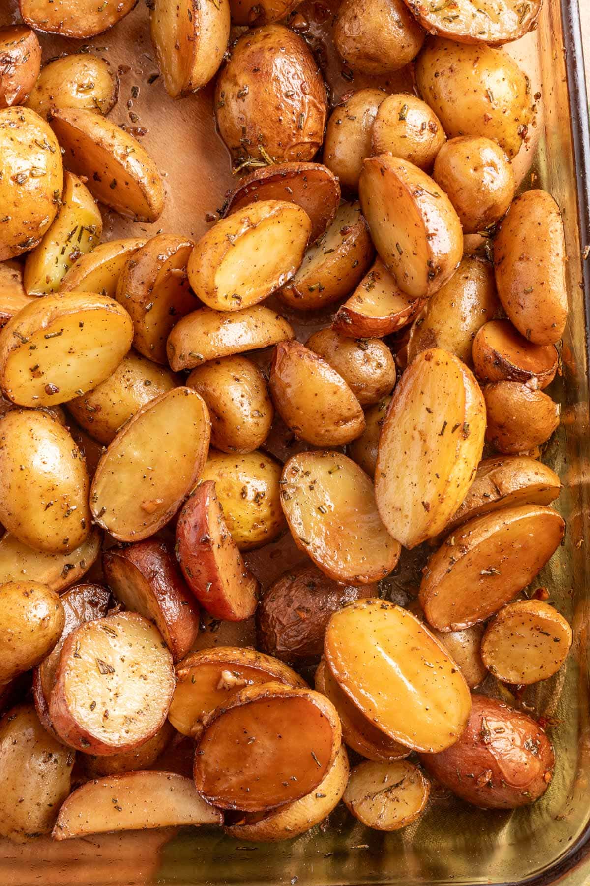 overhead of smoked potatoes in a glass baking dish